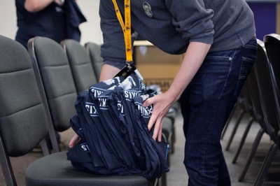 Setting up t-shirts for the Another Slice of W.I.K.I. panel