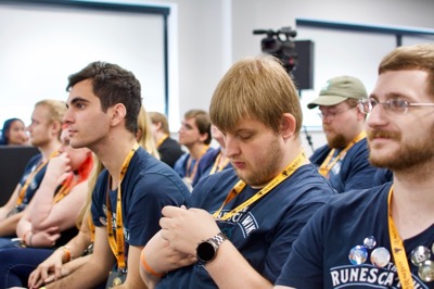 Audience members not paying attention to the panel